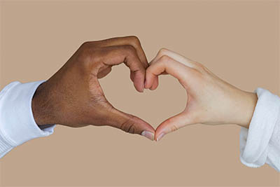 Image of two hands forming a heart